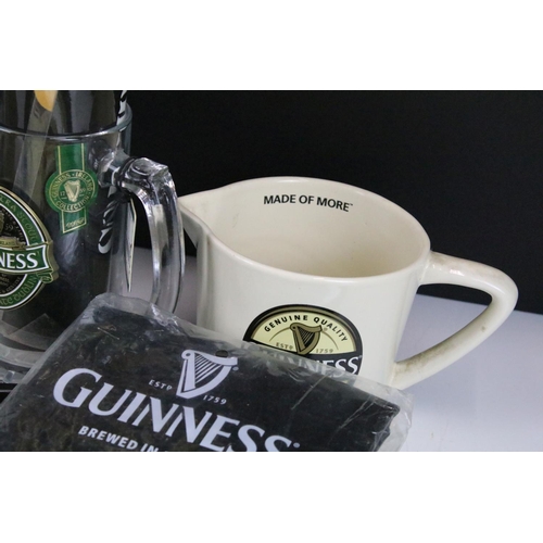 157 - Mixed Guinness promotional advertising items to include toucan salt and pepper pots, bottle clock, p... 