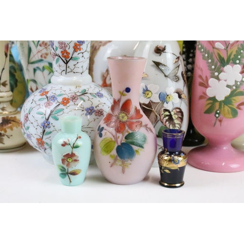 53 - Selection of Victorian hand painted floral decorative glass vases in various sizes and shapes, to in... 