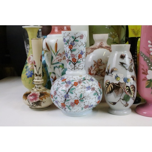 53 - Selection of Victorian hand painted floral decorative glass vases in various sizes and shapes, to in... 