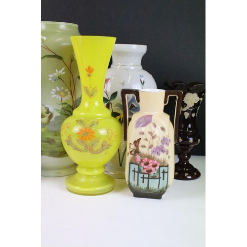 53 - Selection of Victorian hand painted floral decorative glass vases in various sizes and shapes, to in... 