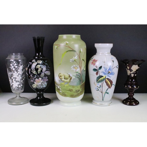 53 - Selection of Victorian hand painted floral decorative glass vases in various sizes and shapes, to in... 