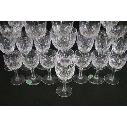 56 - Stuart crystal glasses, all etched on base, to include eight tall hock glasses, eight claret, six sh... 