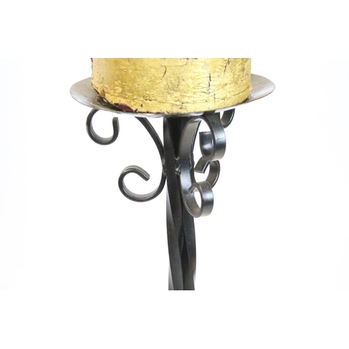 596 - Cast iron torchere candle stand having round dish to top raised on a scrolled iron tripod base. Meas... 