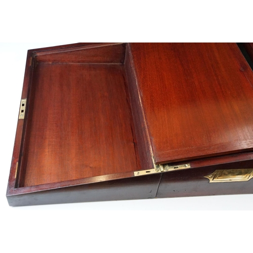 128 - Mahogany writing slope box with brass handles and inlay detailing, complete with two inkwells, two l... 