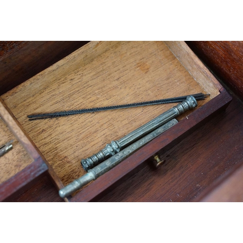 128 - Mahogany writing slope box with brass handles and inlay detailing, complete with two inkwells, two l... 