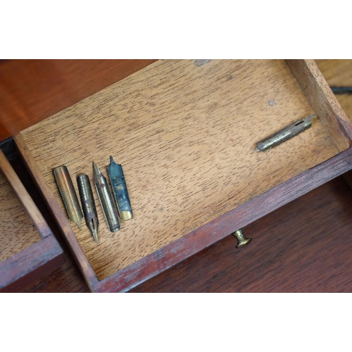 128 - Mahogany writing slope box with brass handles and inlay detailing, complete with two inkwells, two l... 