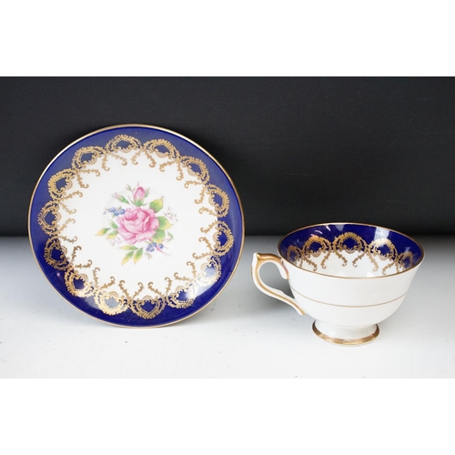 14 - Aynsley cobalt blue floral tea cup and saucers x 2, Aynsley pink and gold fruit design with gilt det... 