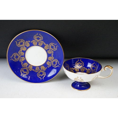 14 - Aynsley cobalt blue floral tea cup and saucers x 2, Aynsley pink and gold fruit design with gilt det... 