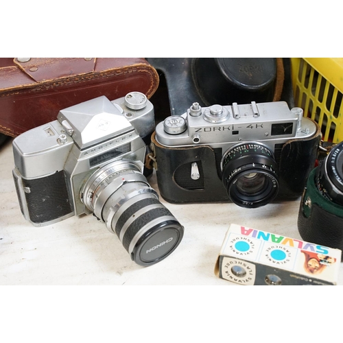 160 - Cameras to include models by Minolta, Exakta, Ambiflex, Zorki with lenses, film and accessories.