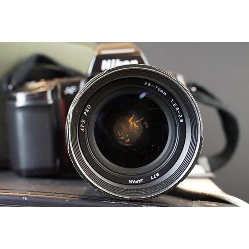 171 - Collection of four cased SLR cameras with lenses. Nikon N8008S fitted with 28-70mm Tokina f/2.6-2.8,... 