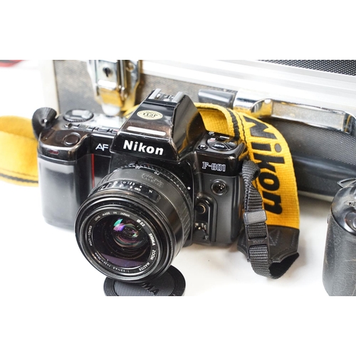 171 - Collection of four cased SLR cameras with lenses. Nikon N8008S fitted with 28-70mm Tokina f/2.6-2.8,... 