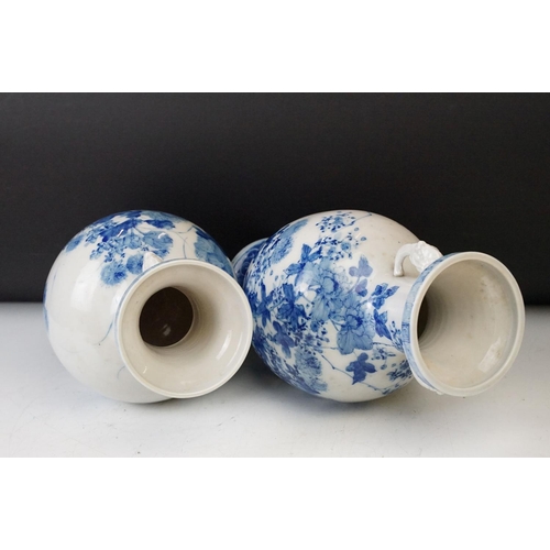 2 - Two 19th century Chinese blue and white twin handled vases with hand painted floral decoration and r... 