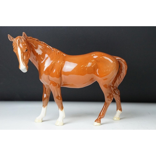 22 - Royal Doulton 'Appaloosa' stallion horse and Beswick chestnut horse ceramic gloss figurines. 20cm ta... 