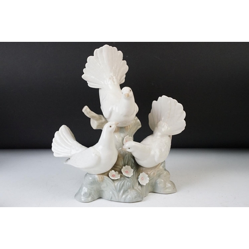 27 - Collection of three Lladro figurines of girls with geese and a lamb, 30cm tallest, all stamped at ba... 