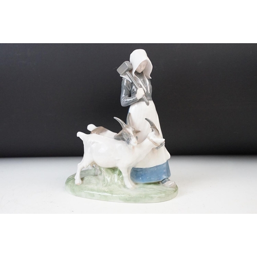 34 - Trio of Royal Copenhagen farm children figurine depicted with goats, No 694, calf, No 772 and geese,... 