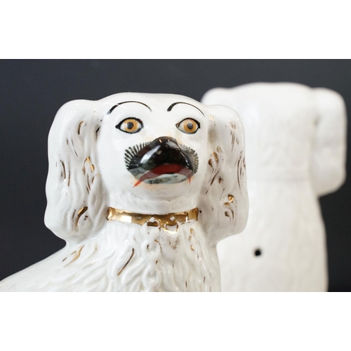 36 - Pair of flat backed Staffordshire dogs, ornamental Spaniel figures. with gilt collar detail and fur ... 