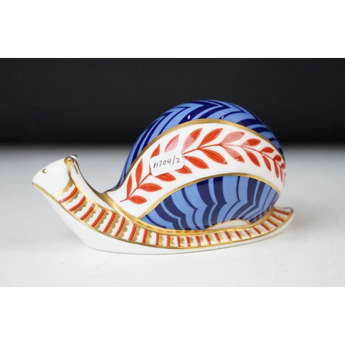 39 - Royal Crown Derby Imari pattern snail paperweight with gold stamped base stopper along with large Mu... 