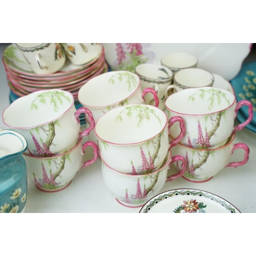 49 - Royal Albert 'Foxglove' pink handled eight cups and saucers, eight side plates, milk jug and cake pl... 