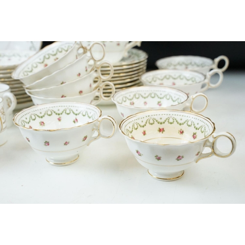 60 - Crescent & sons pink floral garland with gold edging comprising of eleven saucers, eleven side plate... 