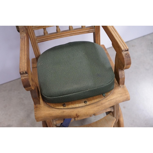 612 - Early 20th century child's high chair, with green leatherette studded seat and back, 85cm high