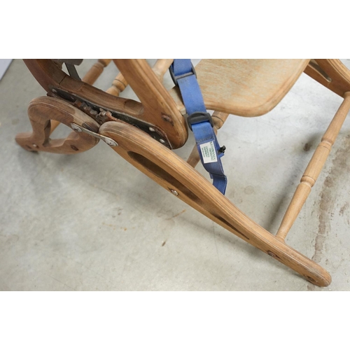 612 - Early 20th century child's high chair, with green leatherette studded seat and back, 85cm high