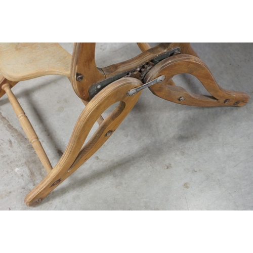 612 - Early 20th century child's high chair, with green leatherette studded seat and back, 85cm high