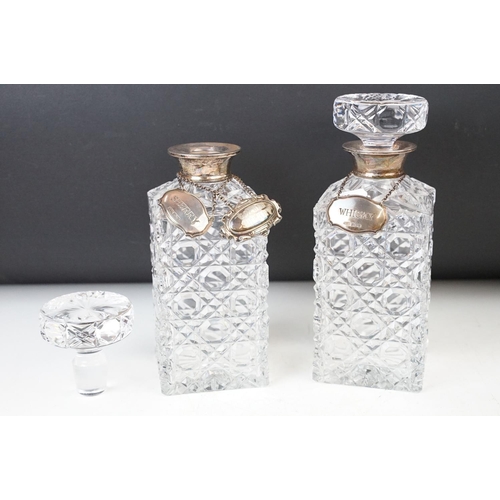 64 - Selection of cut glass crystal to include, two square decanters with Whisky and Sherry neck labels, ... 