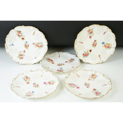 74 - Coalport floral spray and gilt decoration cake stands, handled cake plate and five plates.