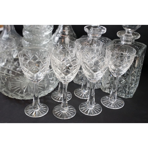 78 - Large selection of cut glass with decanters including two square cut, one round and a ship decanter ... 