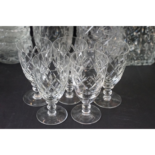 78 - Large selection of cut glass with decanters including two square cut, one round and a ship decanter ... 