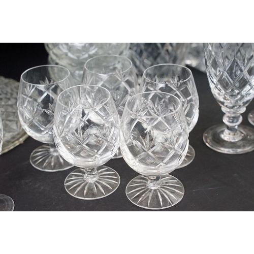 78 - Large selection of cut glass with decanters including two square cut, one round and a ship decanter ... 