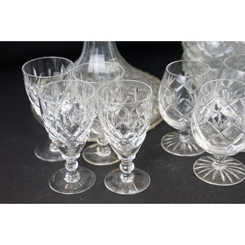 78 - Large selection of cut glass with decanters including two square cut, one round and a ship decanter ... 