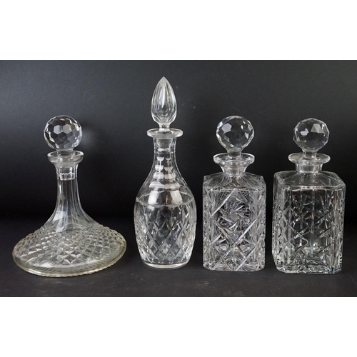 78 - Large selection of cut glass with decanters including two square cut, one round and a ship decanter ... 