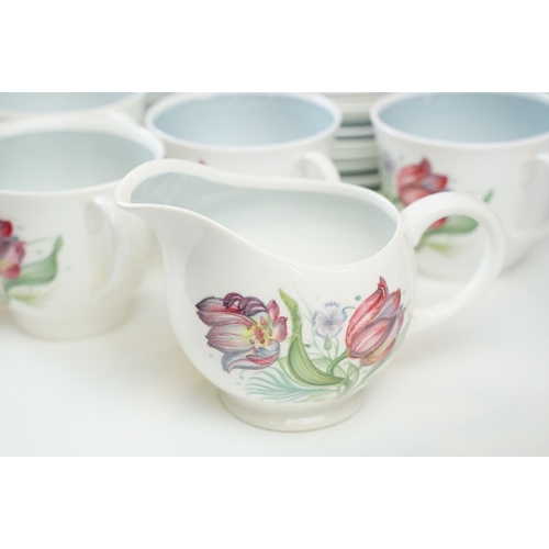 79 - Susie Cooper tea set in Parrot Tulip design with blue surround, to include two cake plates, ten tea ... 