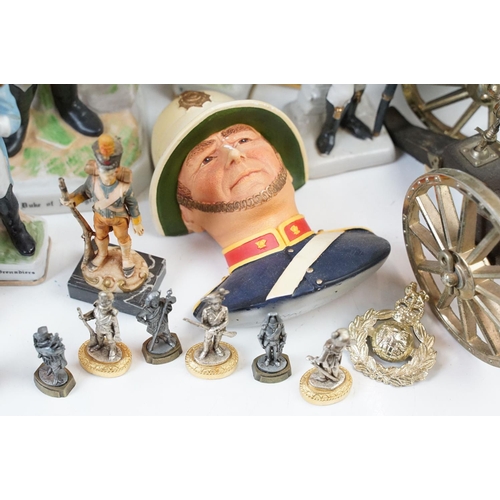 81 - Two small table canons and a selection of historical and military figurines, Duke of Wellington, Nap... 