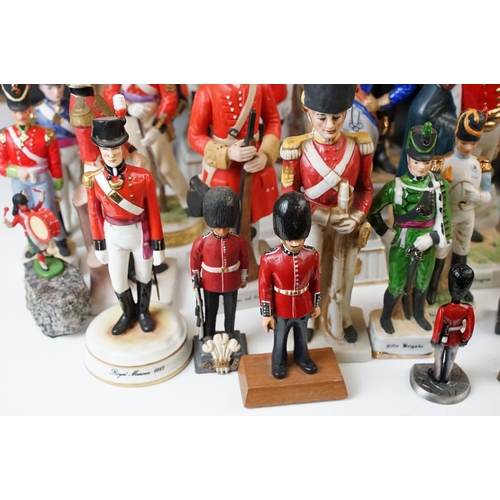 81 - Two small table canons and a selection of historical and military figurines, Duke of Wellington, Nap... 