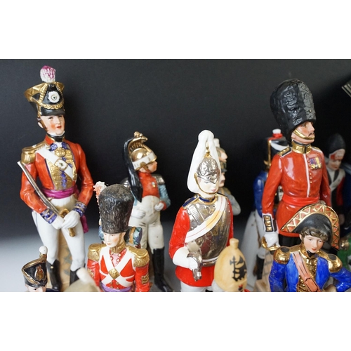 81 - Two small table canons and a selection of historical and military figurines, Duke of Wellington, Nap... 