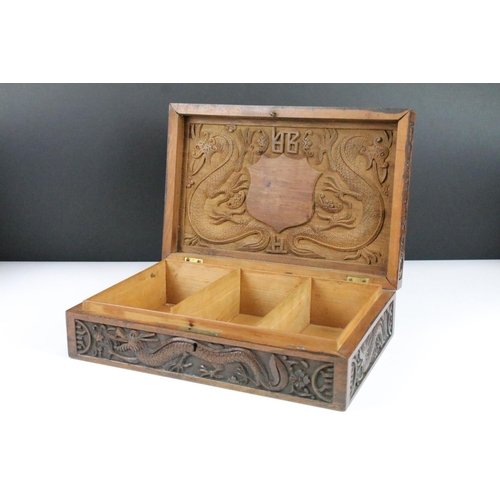 102 - Intricately carved dragon table top box with raised relief dragon to lift up top and carved dragon d... 