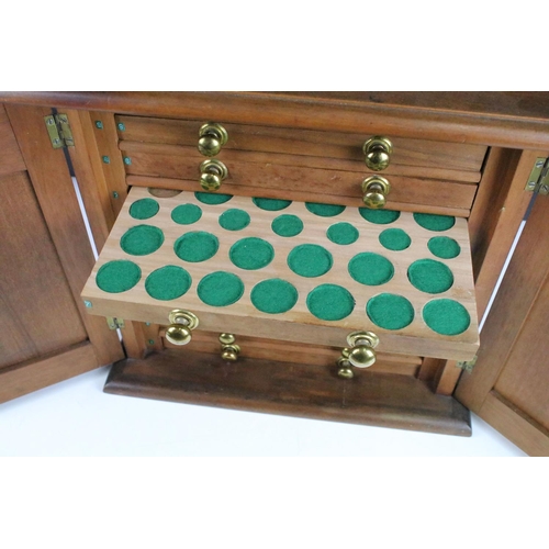 107 - Table top cabinet for coin collecting with ten drawers with assorted sized felt lined coin spacers, ... 