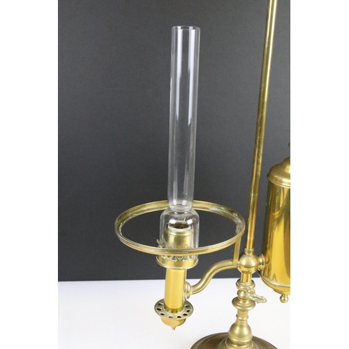 113 - Victorian brass adjustable student lamp with green glass lamp shade and glass chimney.