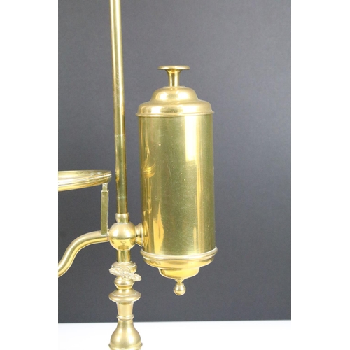 113 - Victorian brass adjustable student lamp with green glass lamp shade and glass chimney.