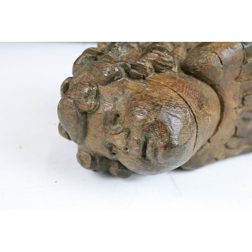 119 - Carved wood head of cherub with feathers detail wall bracket 16cm high x 8cm wide x 13cm deep with a... 