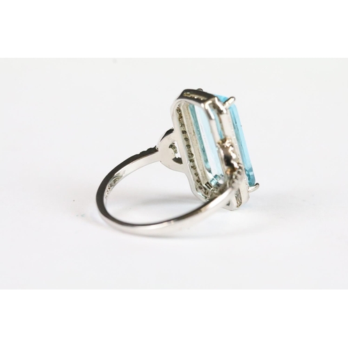 219 - A ladies sterling silver dress ring set with central blue stone, marked 925 to the inner shank.