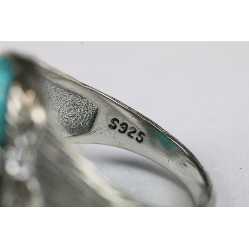 225 - A ladies sterling silver ring with central turquoise cabochon, marked 925 to the shank.