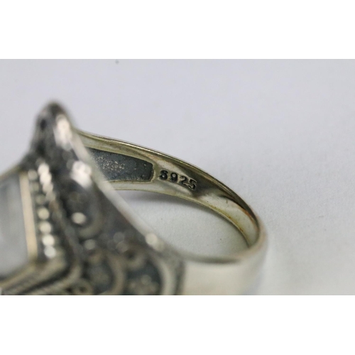 227 - A ladies sterling silver ring with central moonstone, marked 925 to the shank.