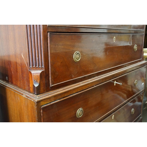 595 - 19th Century mahogany chest on chest having rounded medallion handles canted reeded corners to the t... 