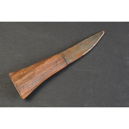 100 - A mid 20th century Kukri knife, decorative dot engraved steel blade, wooden handle with brass fixing... 