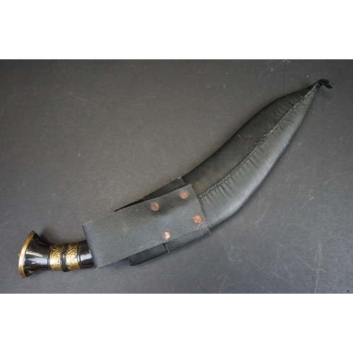 104 - A 3 Chirre / Fuller bladed Kukri knife, steel blade, horn handle with double brass banding, leather ... 