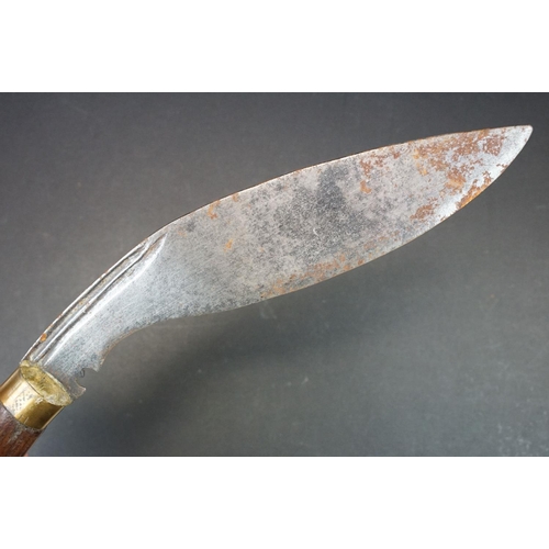 107 - A early to mid 20th century (c.1920-30) Kukri knife, steel blade with two fuller to upper blade, woo... 