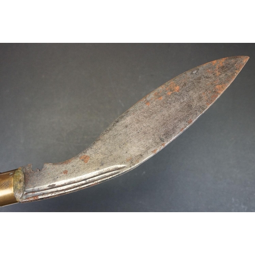 107 - A early to mid 20th century (c.1920-30) Kukri knife, steel blade with two fuller to upper blade, woo... 